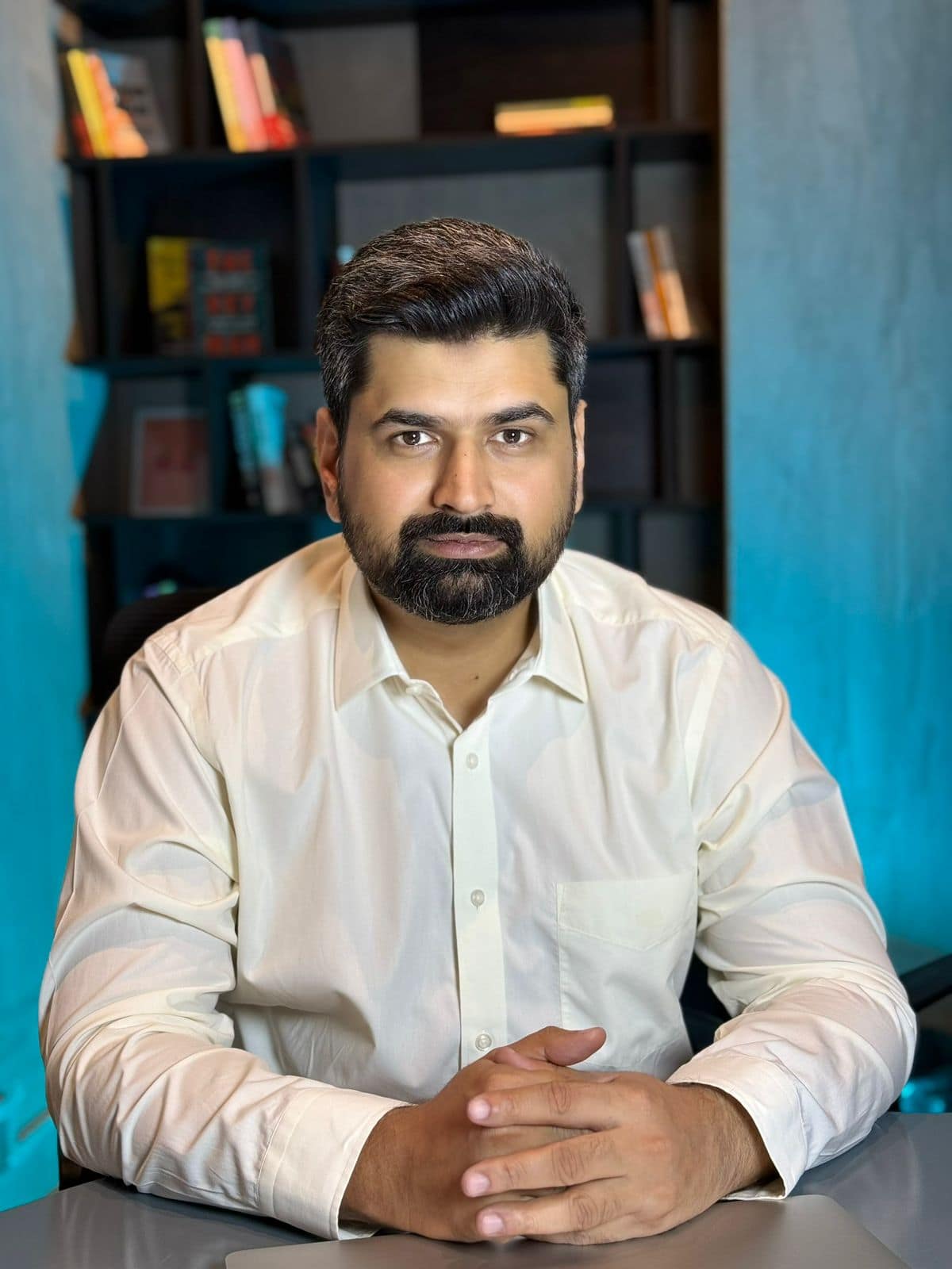 Nadir Dogar, business strategy and AI consultant, seated at his desk